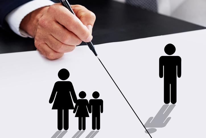 Cropped shot of a businessman drawing a dividing line between a father, his children and their mother
